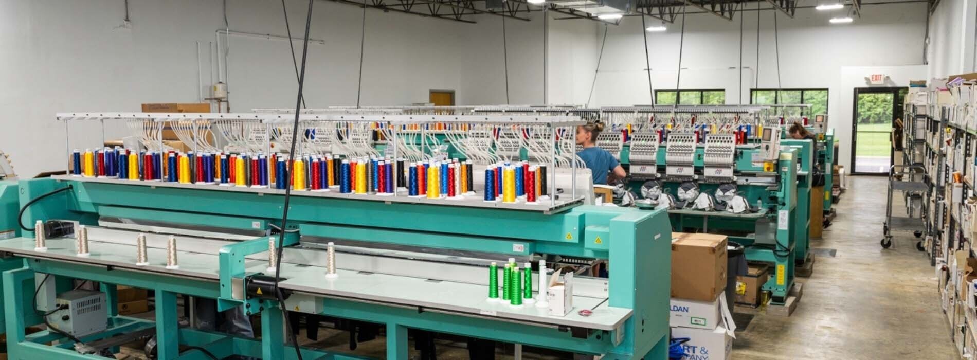 rows of embroidery machines with thread